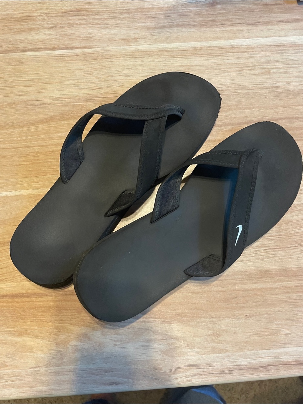Nike Black women’s Flip Flop Sandals with White Swoosh